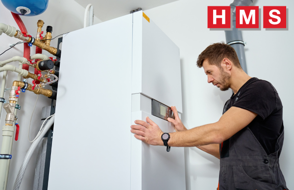 A heating engineer in Ledbury servicing a boiler
